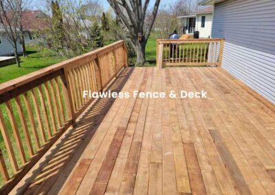 Wood deck install with wooden railing and stairs