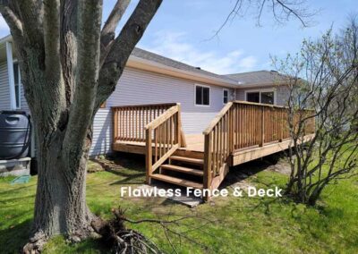 Wooden deck install with stairs and railing